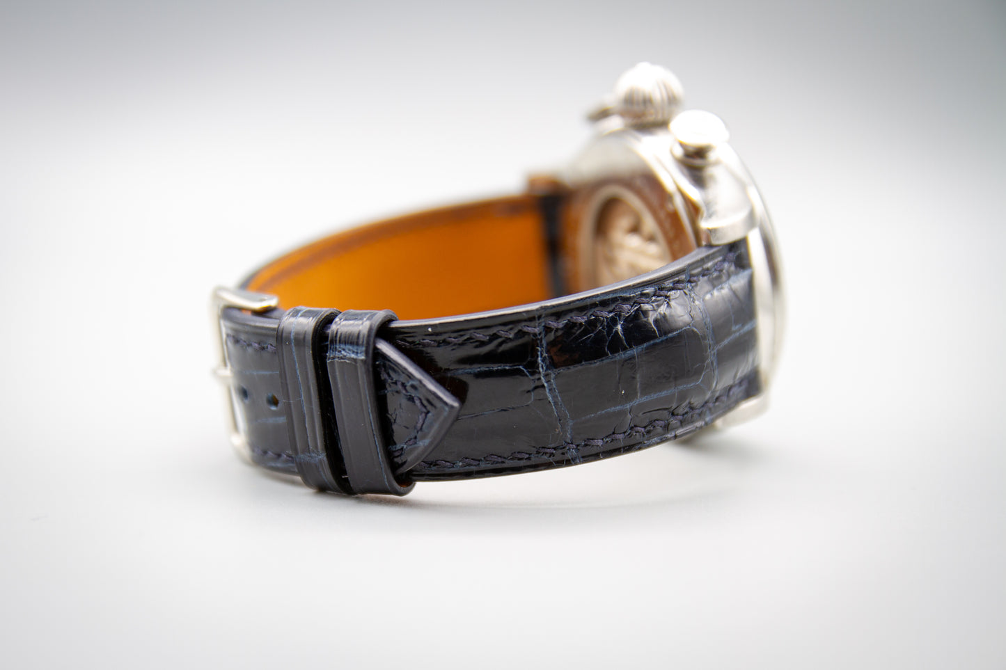 
                  
                    Midnight blue alligator leather watch strap with custom hand stitching
                  
                