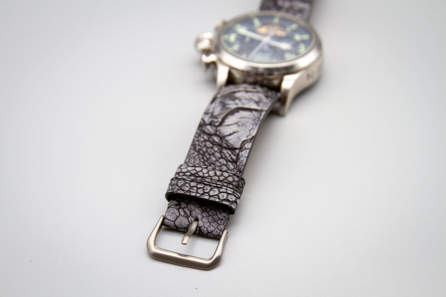
                  
                    Handcrafted stone washed grey ostrich leg watch band flat lay
                  
                