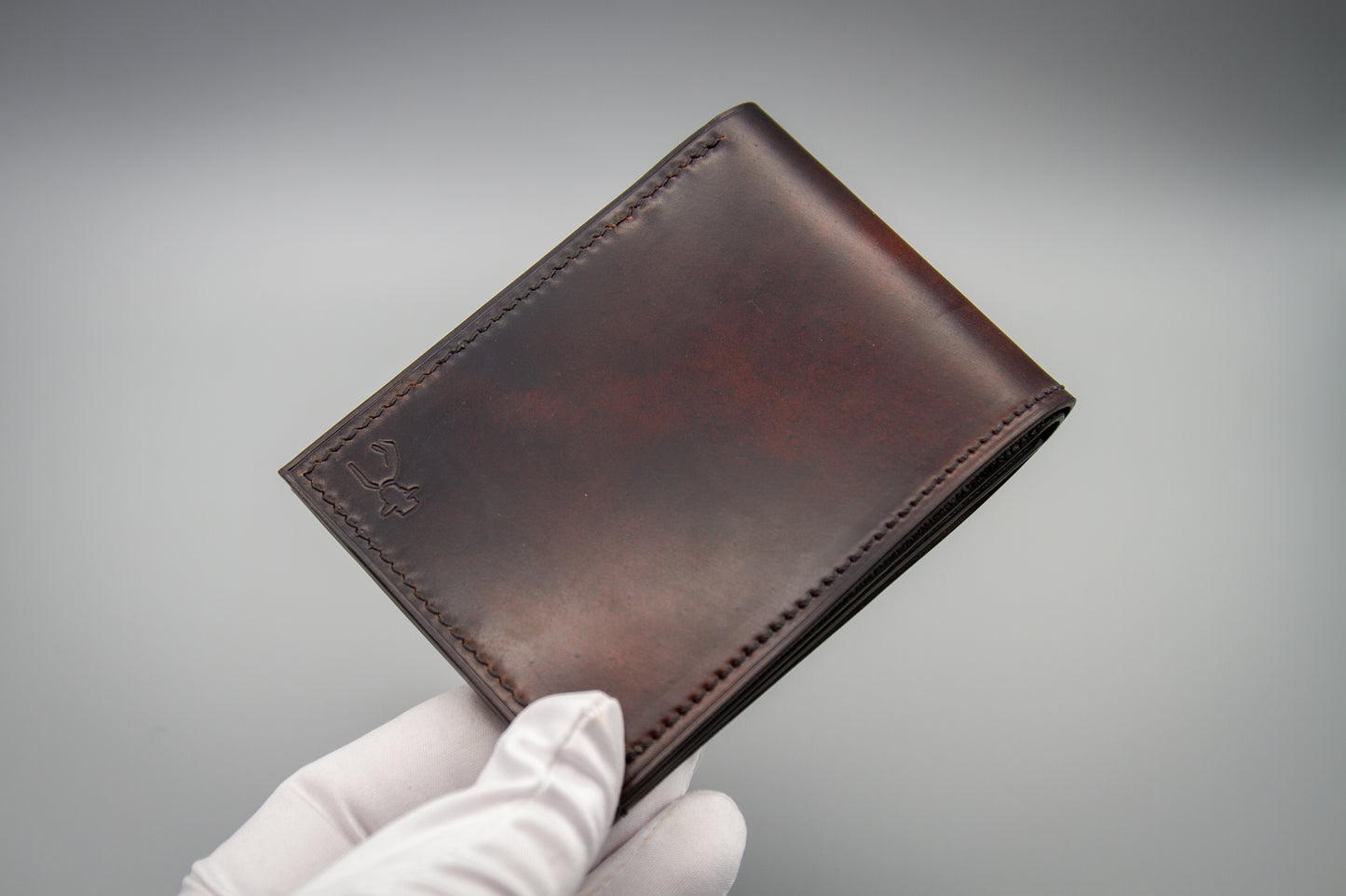 Closed marbled Horween shell cordovan bifold wallet showing unique marbling pattern