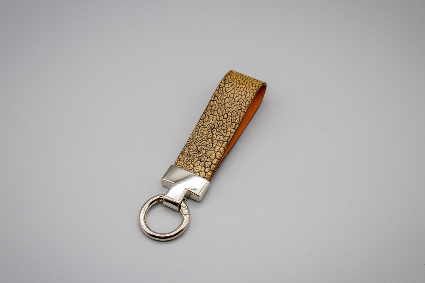 
                  
                    Luxury Leather Keychain - Metallic Brown Ostrich
                  
                