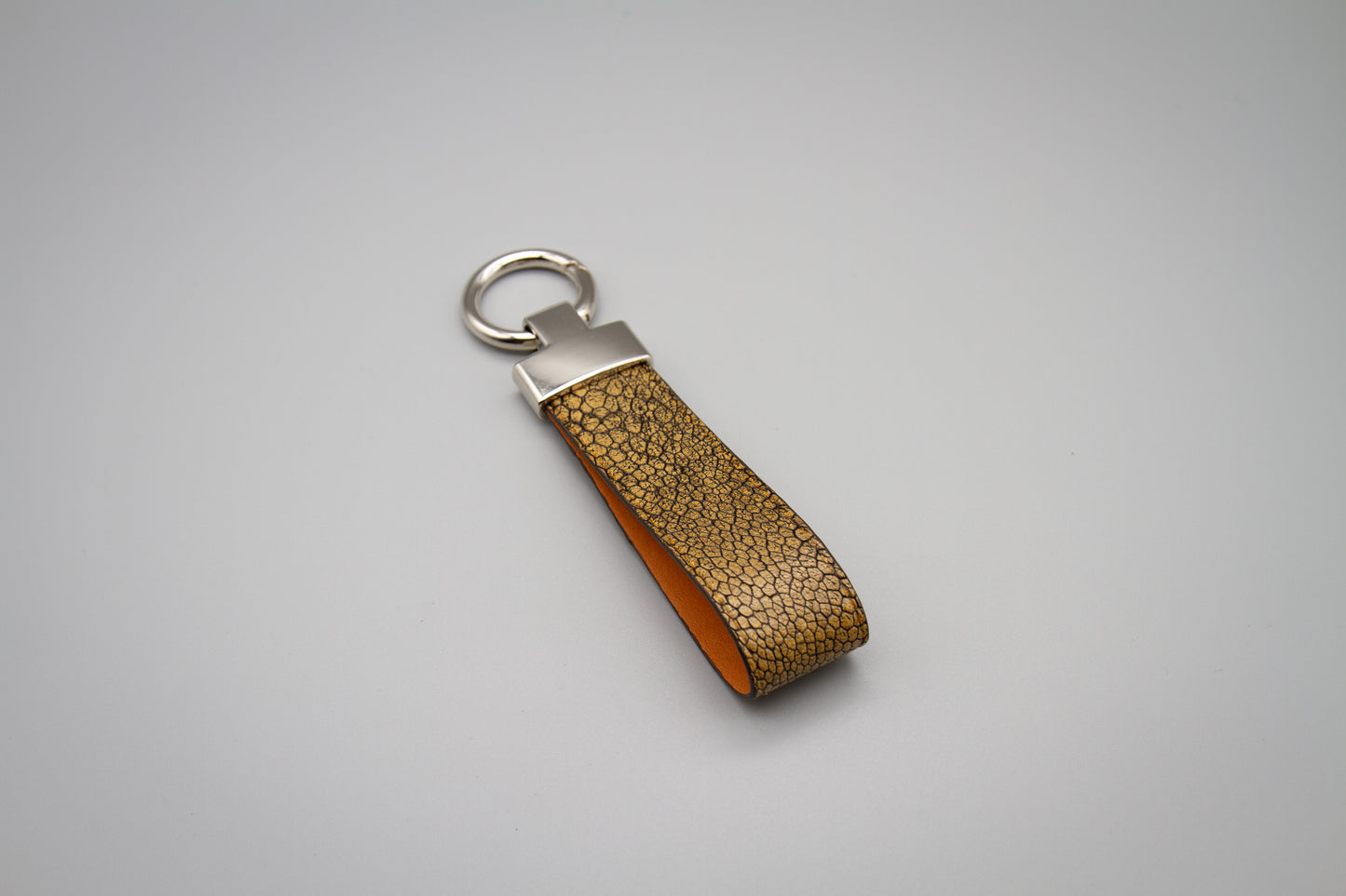 
                  
                    Luxury Leather Keychain - Metallic Brown Ostrich
                  
                
