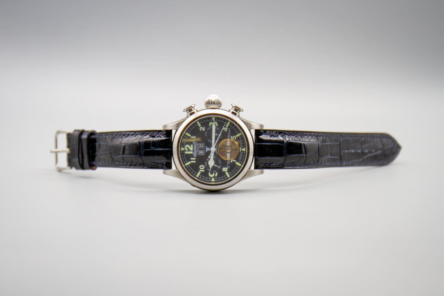 
                  
                    Detail shot of hand-stitched midnight blue alligator leather watch strap
                  
                