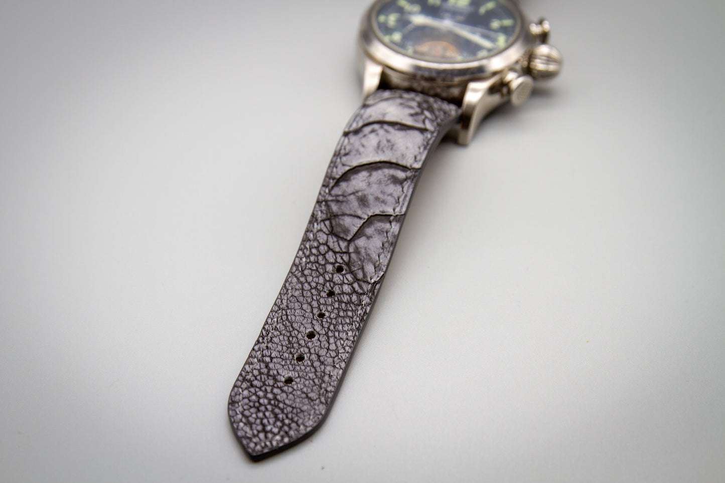 
                  
                    Top-down view of bespoke stone washed grey ostrich leg leather watch strap
                  
                