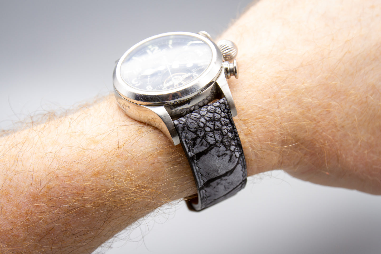 
                  
                    Stone washed grey ostrich leg watch strap mounted on a luxury timepiece
                  
                