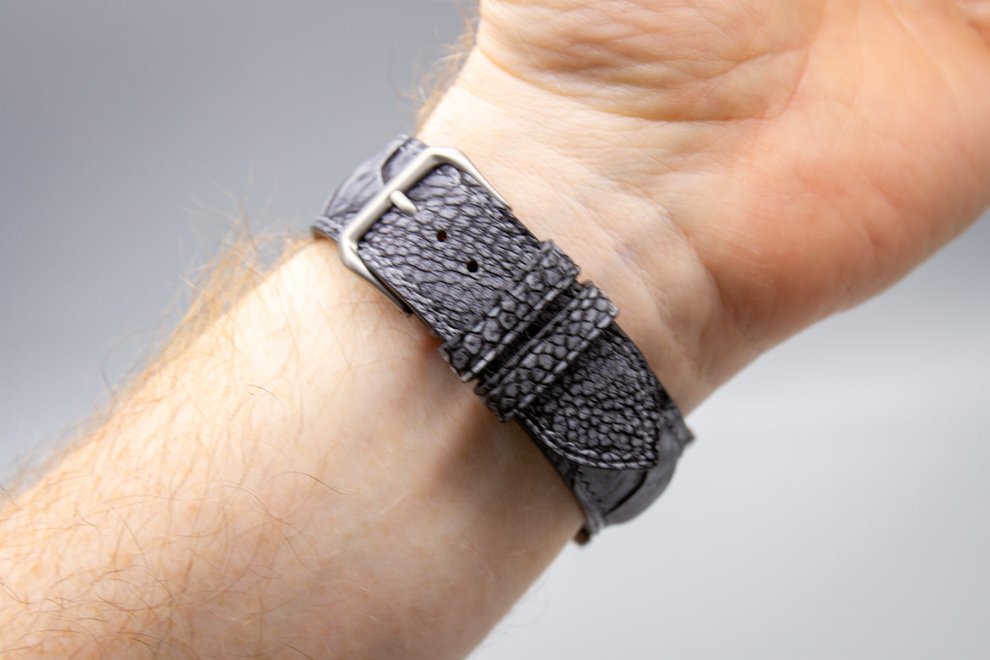 
                  
                    Custom stone washed grey ostrich leg leather watch band on wrist
                  
                