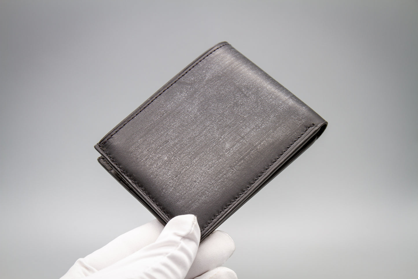 
                  
                    Handmade Italian Belfagor leather bifold wallet in closed position showing natural wax bloom
                  
                