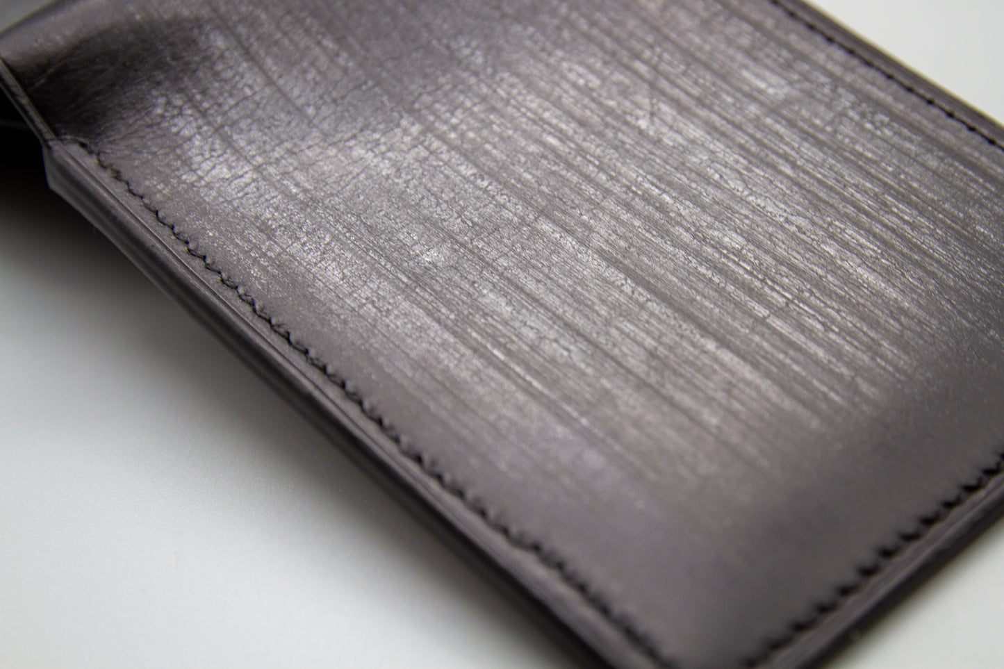 
                  
                    Macro detail of Badalassi Carlo Belfagor leather grain showing natural wax bloom finish
                  
                
