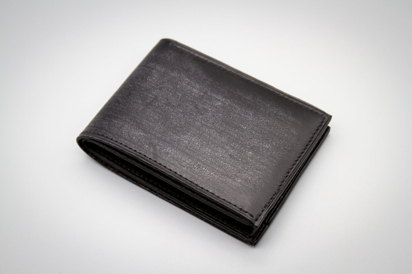 
                  
                    Italian Belfagor leather wallet showing natural pull-up effect and wax bloom transition
                  
                