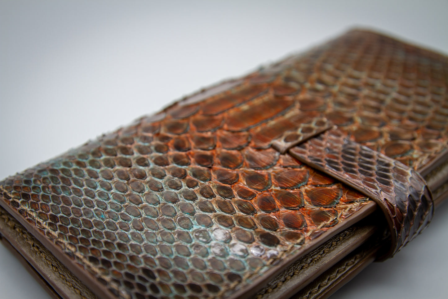 
                  
                    Macro close-up of hand-finished, smooth burnished leather edges and structural stitching lines.
                  
                