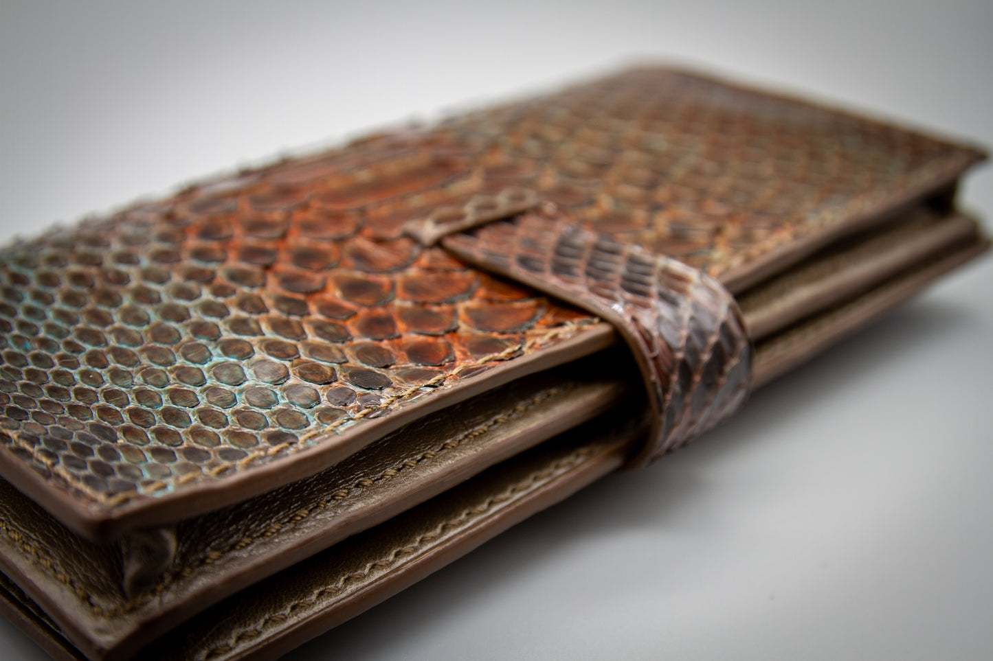 
                  
                    Another close-up photo of hand-painted, smooth edges and structural stitching lines.
                  
                