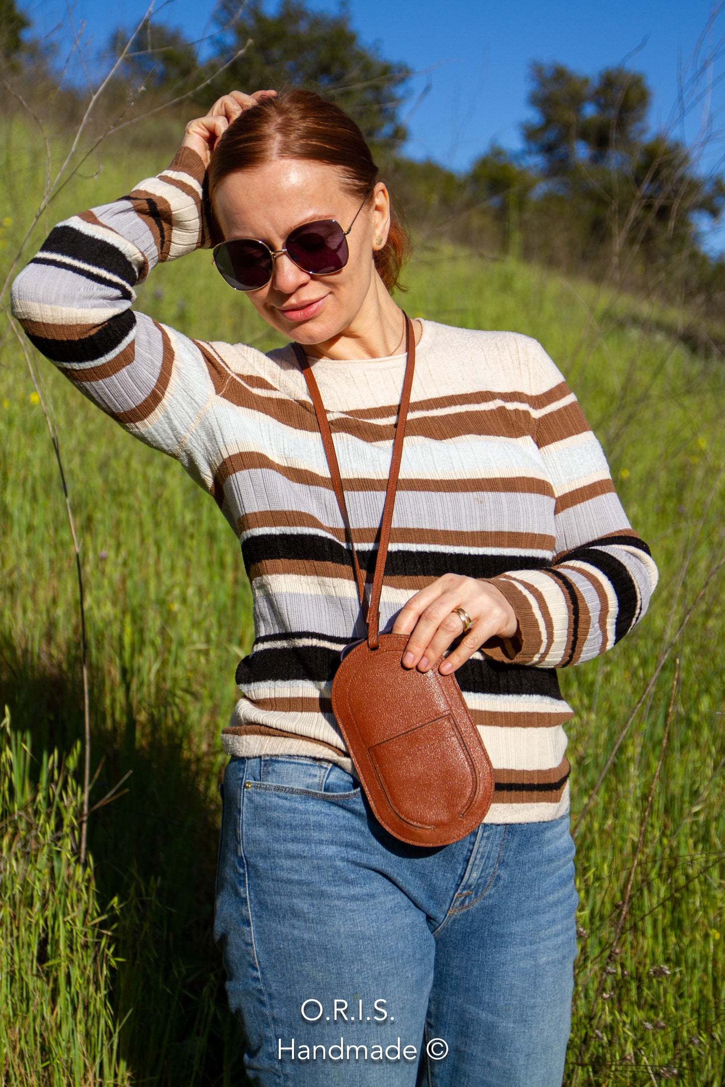 
                  
                    Unisex Phone Pouch in Brown French Chèvre
                  
                